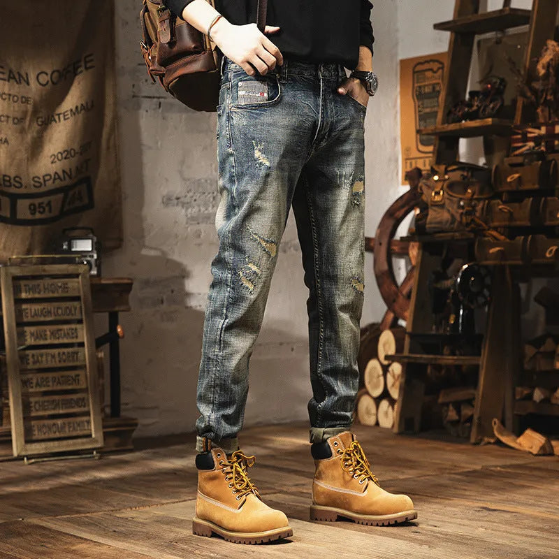 Man wearing vintage blue loose-fit jeans with a drawstring waist, showcasing the fleece-lined interior.