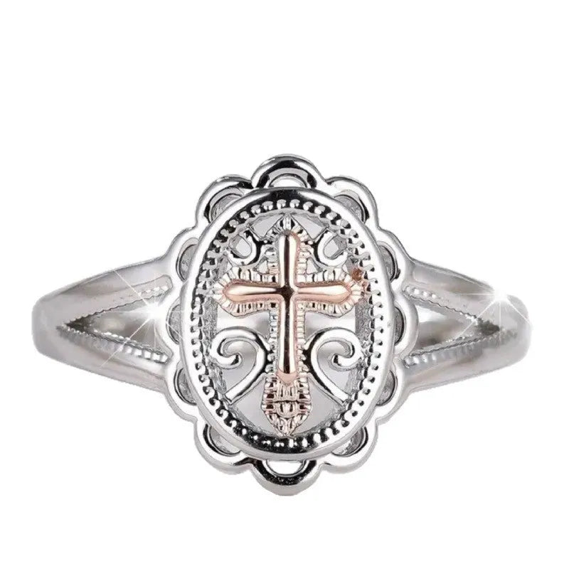 Women's silver cross lace ring showing detailed patterning and electroplated finish