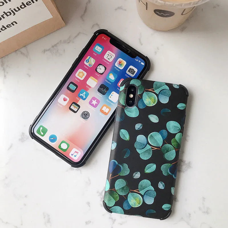 Black silicone iPhone case with a detailed leaf pattern design on the back.