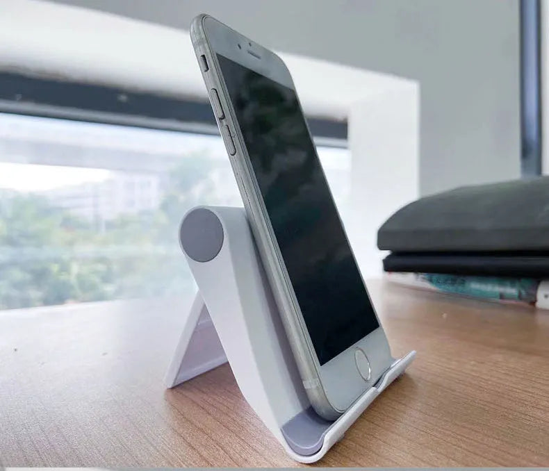 PE folding adjustable desktop phone and tablet stand in assorted colours.