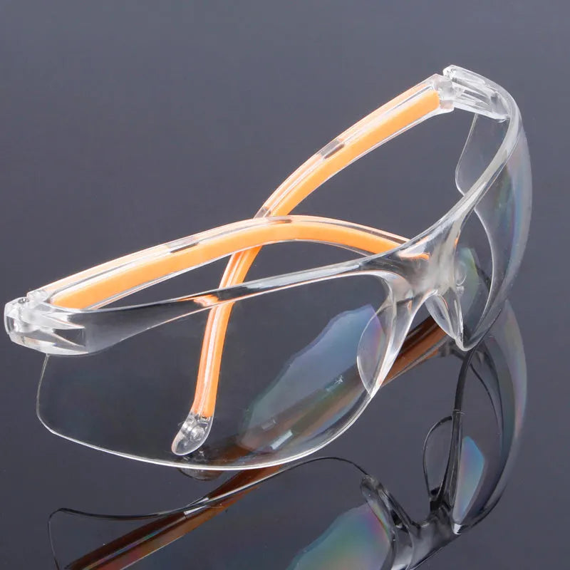 Transparent safety goggles with yellow tinted polycarbonate lenses for lab and welding protection.