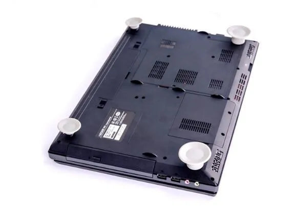 Four grey plastic non-slip cooling pads for laptops, shown in two different sizes.