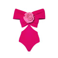 Women's floral patterned one-piece swimsuit with a hollow-out design and a matching skirt.