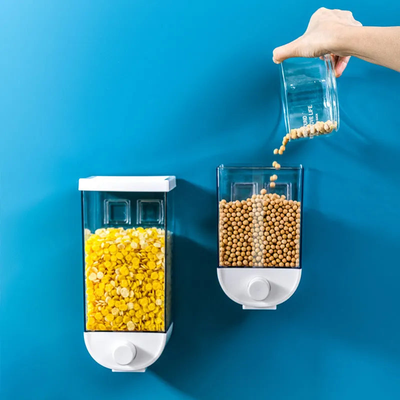 White wall-mounted transparent kitchen storage container with cereal dispenser lid