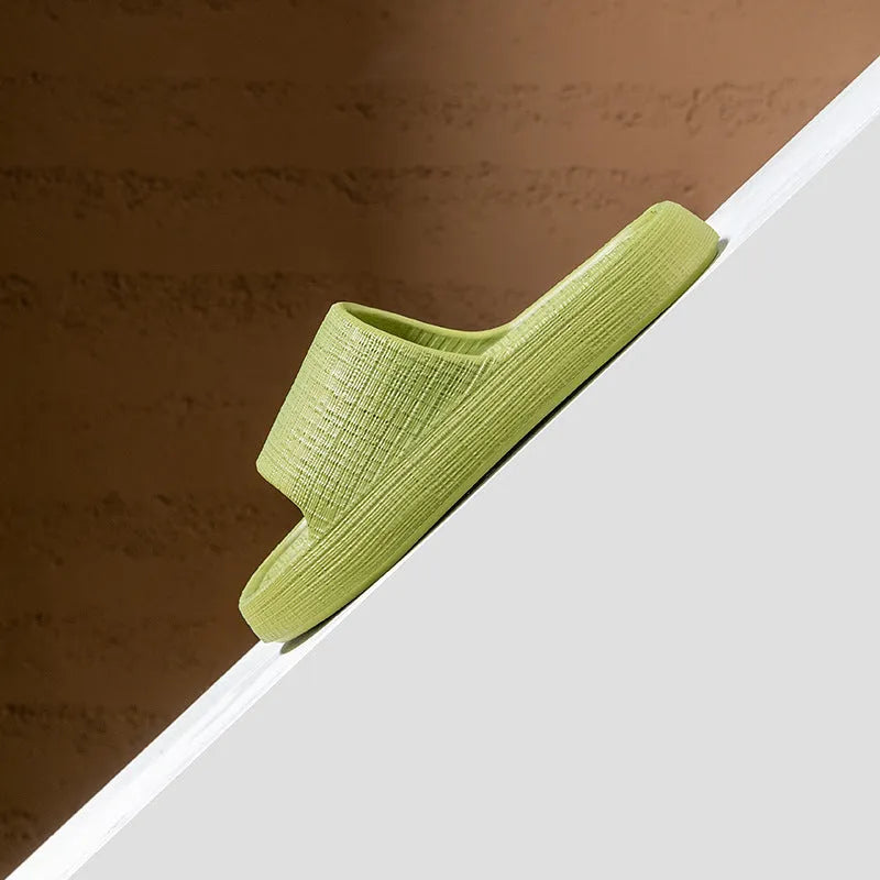 Pair of adult unisex EVA toe-ring slippers in a chosen colour, showing the non-slip sole and flip-flop design.