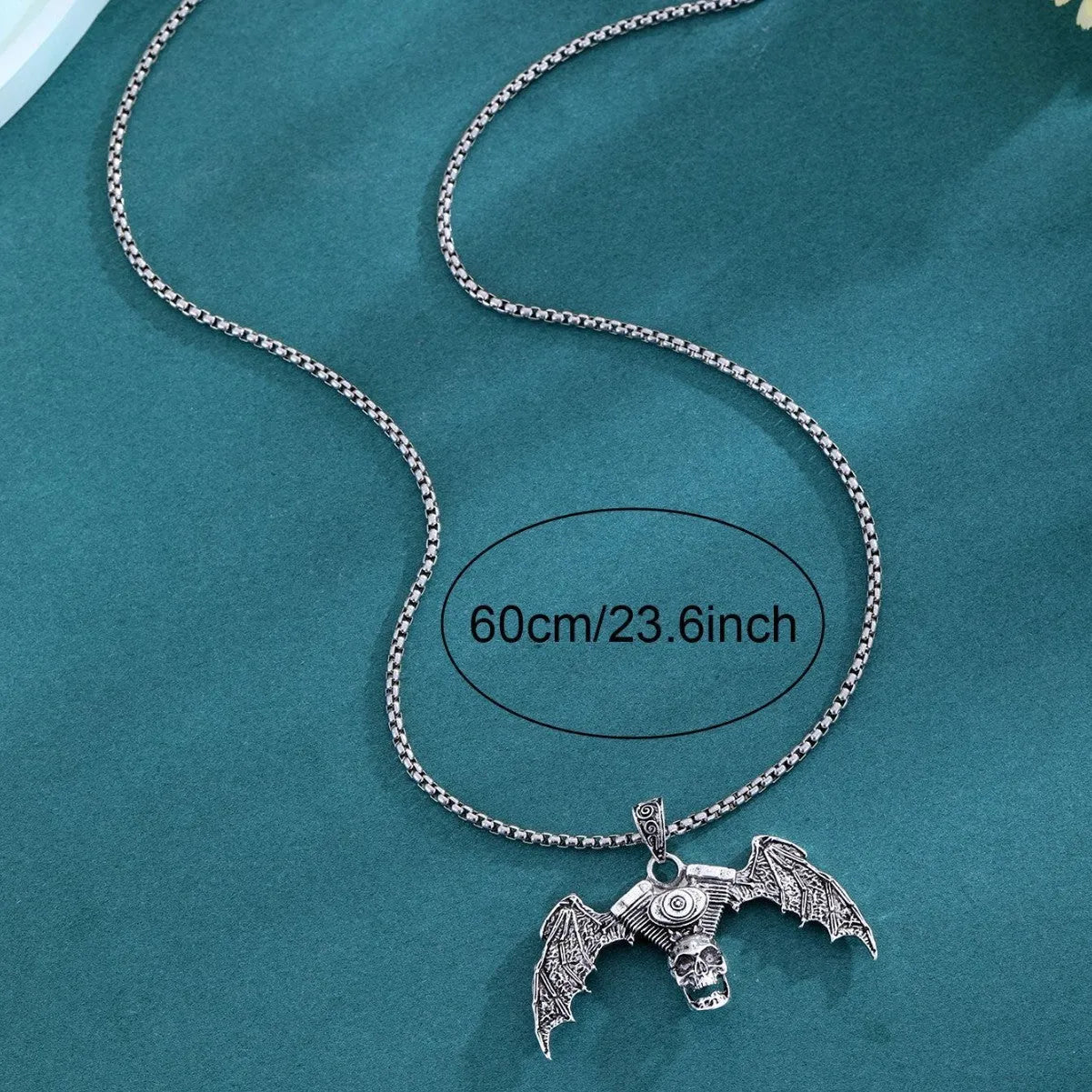 Gothic dark skull alloy necklace with skeleton wing pendant on display