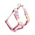 Pink dog harness with gold buckle and colourful heart-shaped stone decoration
