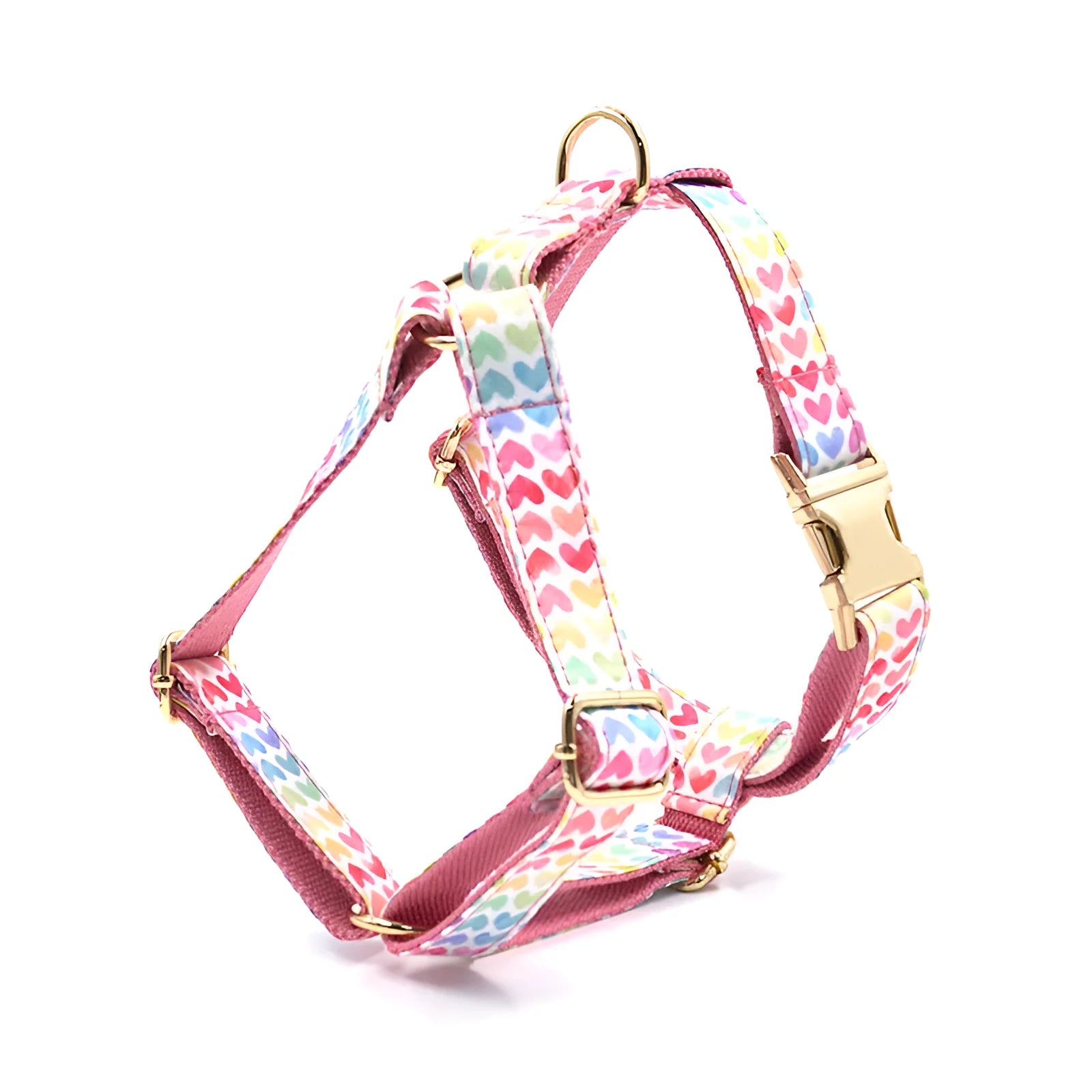 Pink dog harness with gold buckle and colourful heart-shaped stone decoration
