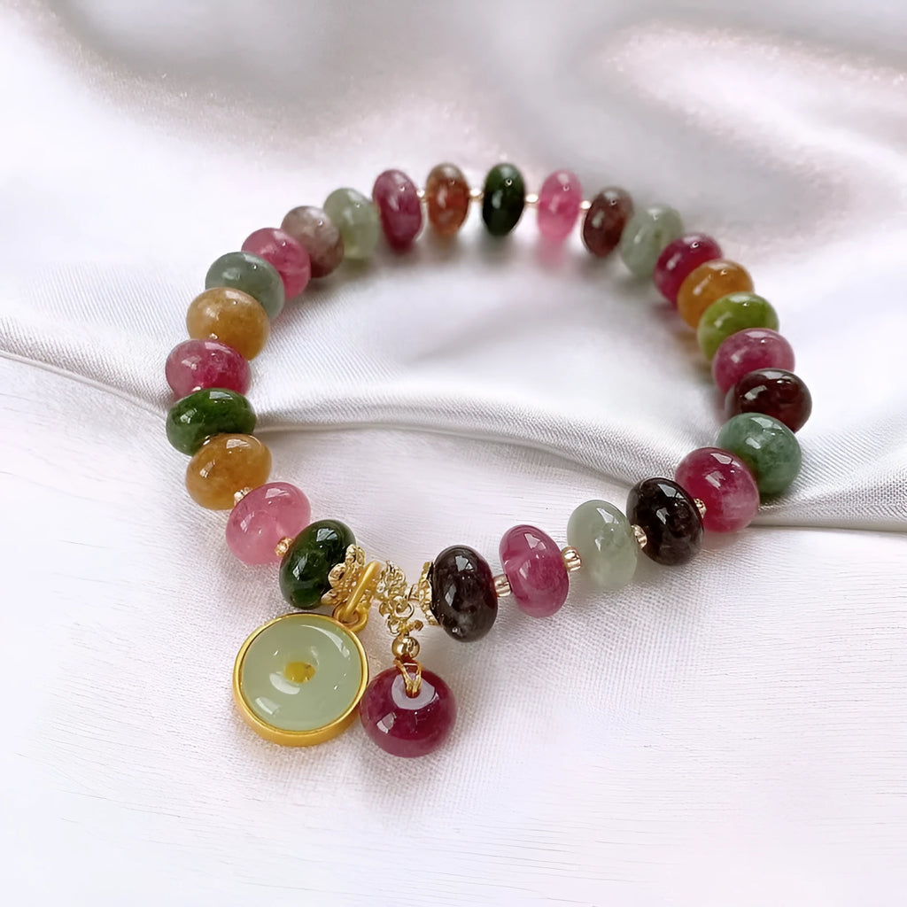 Handmade colourful tourmaline abacus bracelet with rabbit pendant charm on wrist