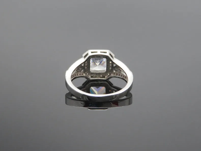 Geometric hollow design zircon ring with platinum colour finish on copper band