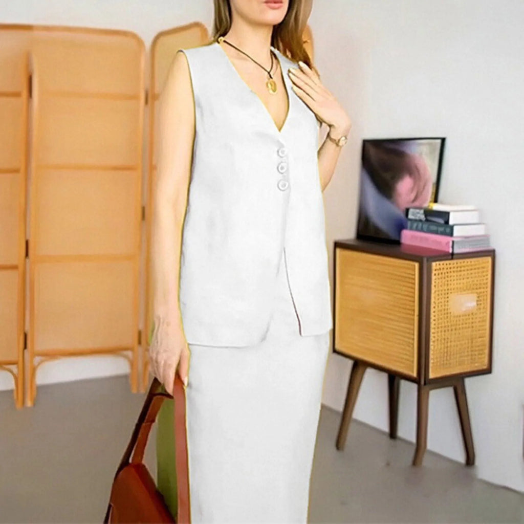White casual women's two-piece set with sleeveless loose vest and long flowing skirt on a hanger.