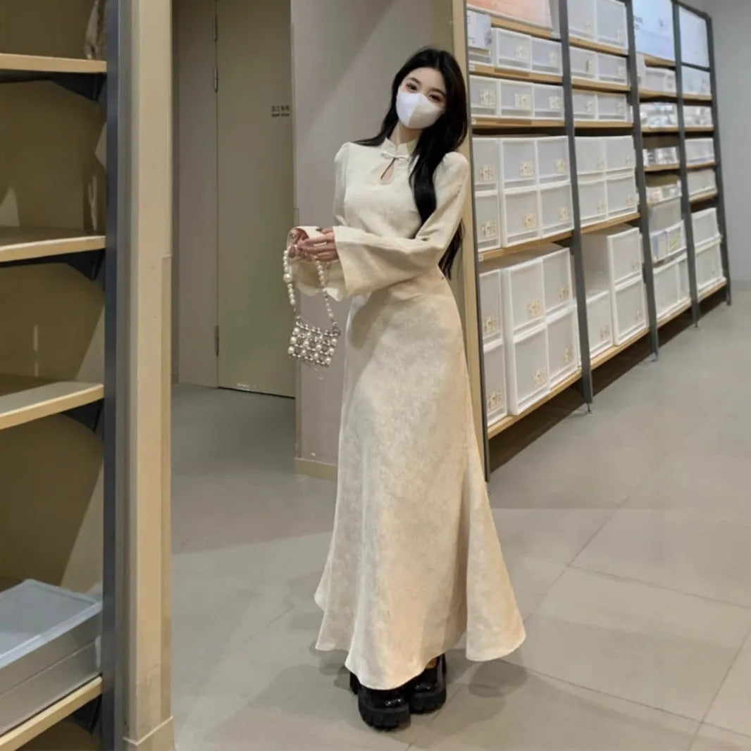 Plus size cheongsam dress in black with waist-tight draping, long sleeves, and long skirt
