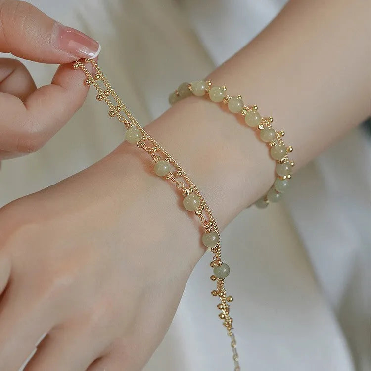 Handcrafted natural Hetian jade bracelet showing bead and charm style variations