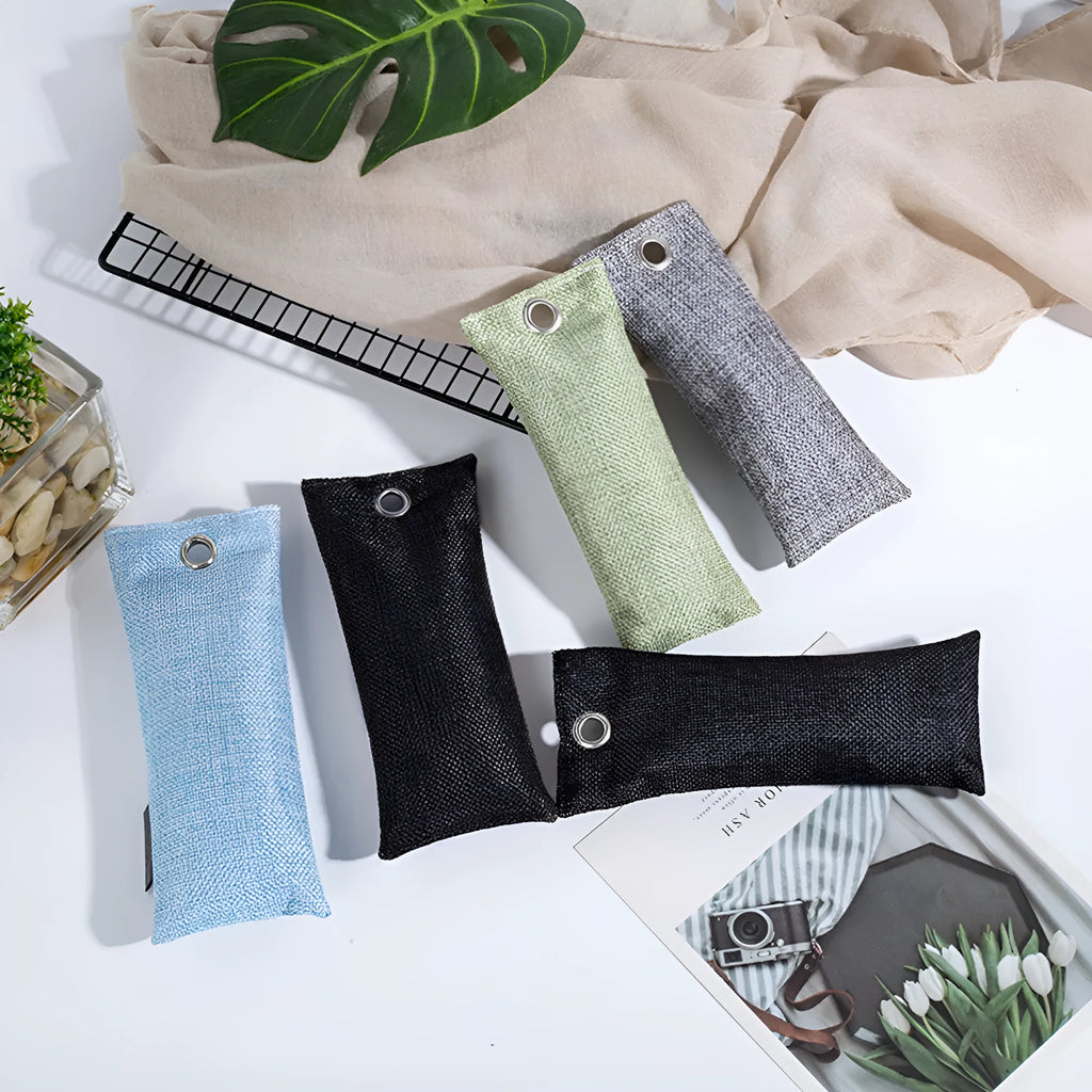 Black activated charcoal deodorising bag made of linen, measuring 16.5cm by 6.5cm.