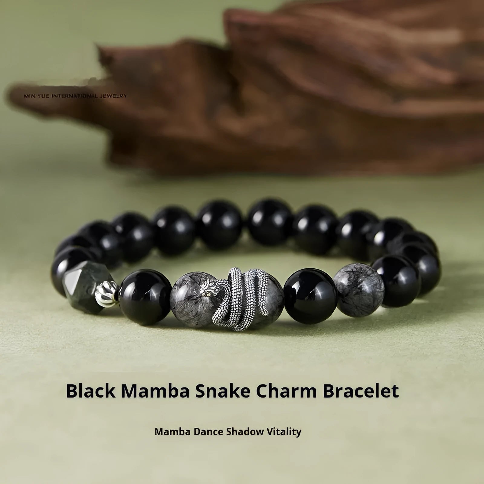 S925 sterling silver men's bracelet with black obsidian crystal and detailed snake design on a wrist.