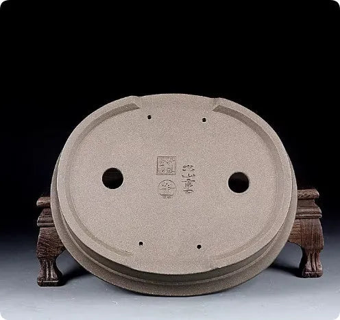 Handmade purple sand clay oval bonsai flower pot showing antique shape and 25x21x6.3cm dimensions