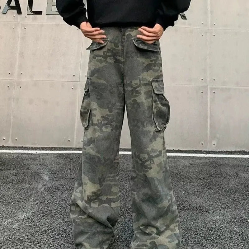 Men's washed camouflage cargo trousers with multiple pockets showing cotton blend fabric