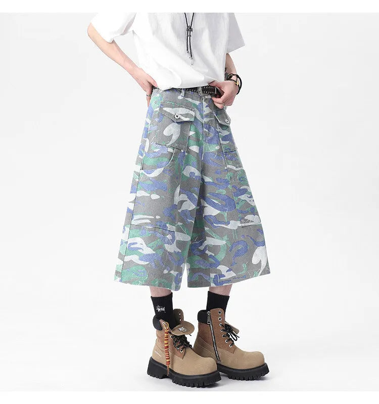 Camouflage pattern cotton cropped cargo trousers on a hanger, showing straight leg and pocket detail.