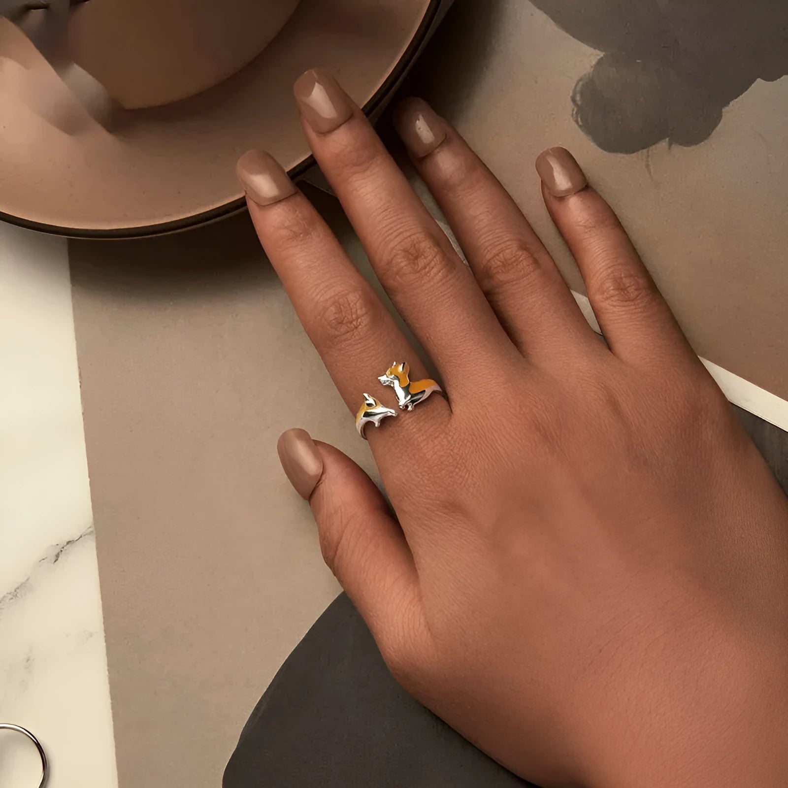Sterling silver adjustable ring with a detailed cartoon Corgi design and electroplated finish.