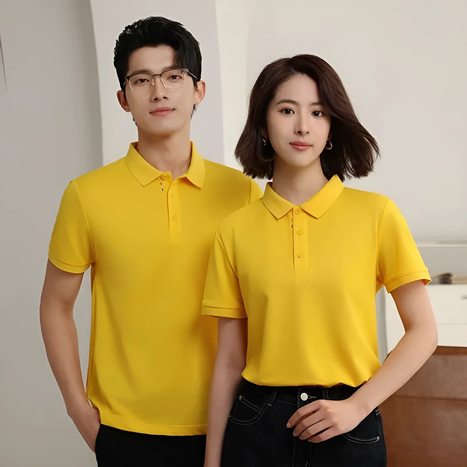 Solid colour short sleeve catering work polo shirt on a hanger, available in multiple colours and sizes.
