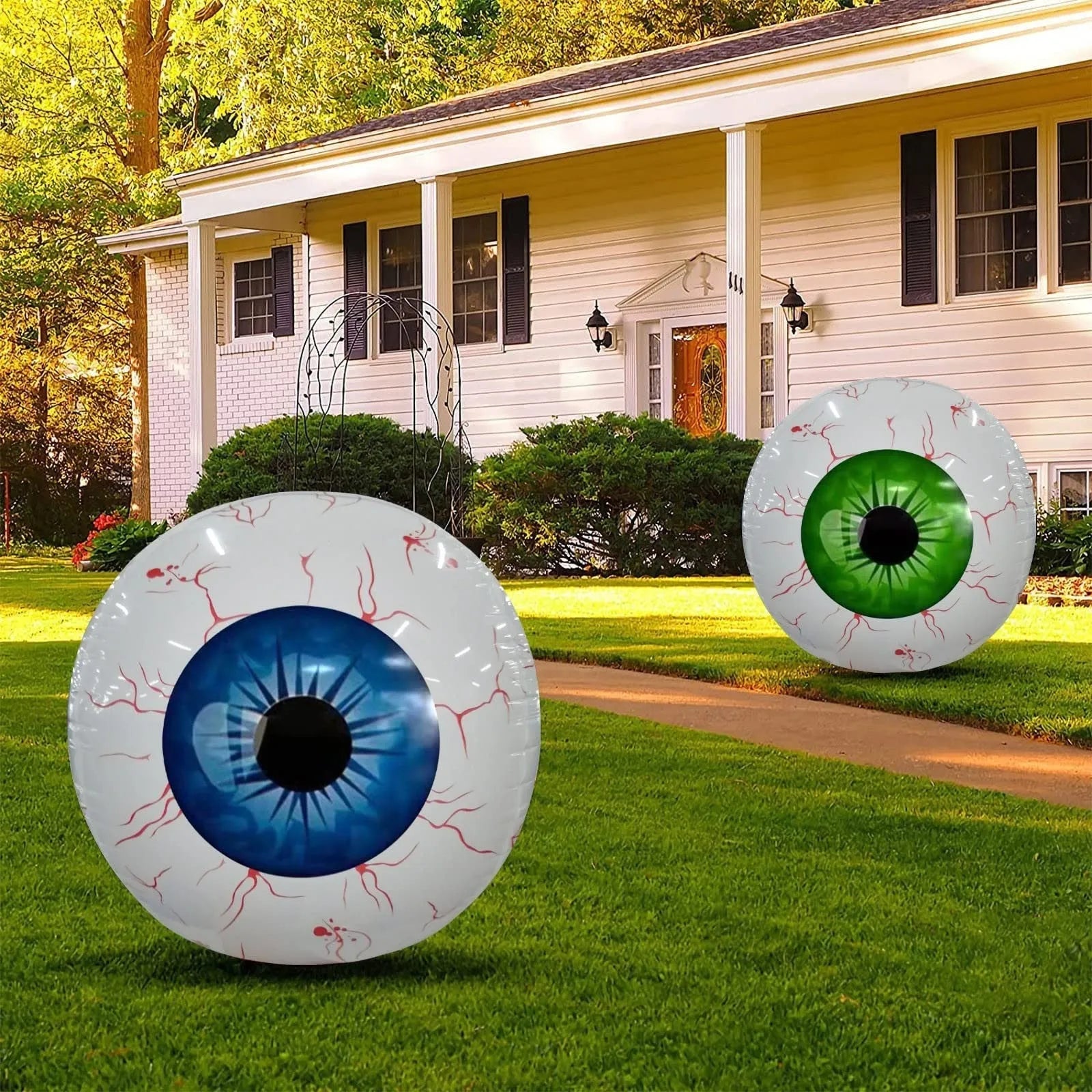 Green Halloween eyeball inflatable balloon with red bloodshot veins, shown inflated