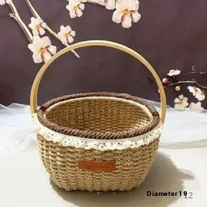 Hand-woven straw basket with hemp rope binding in coffee brown colour, 19cm long by 12cm wide.