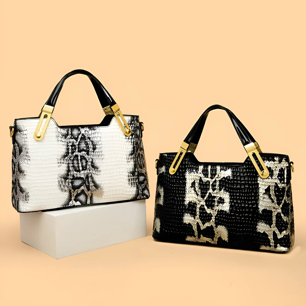 Black retro style shoulder messenger bag with chain detailing and horizontal square silhouette