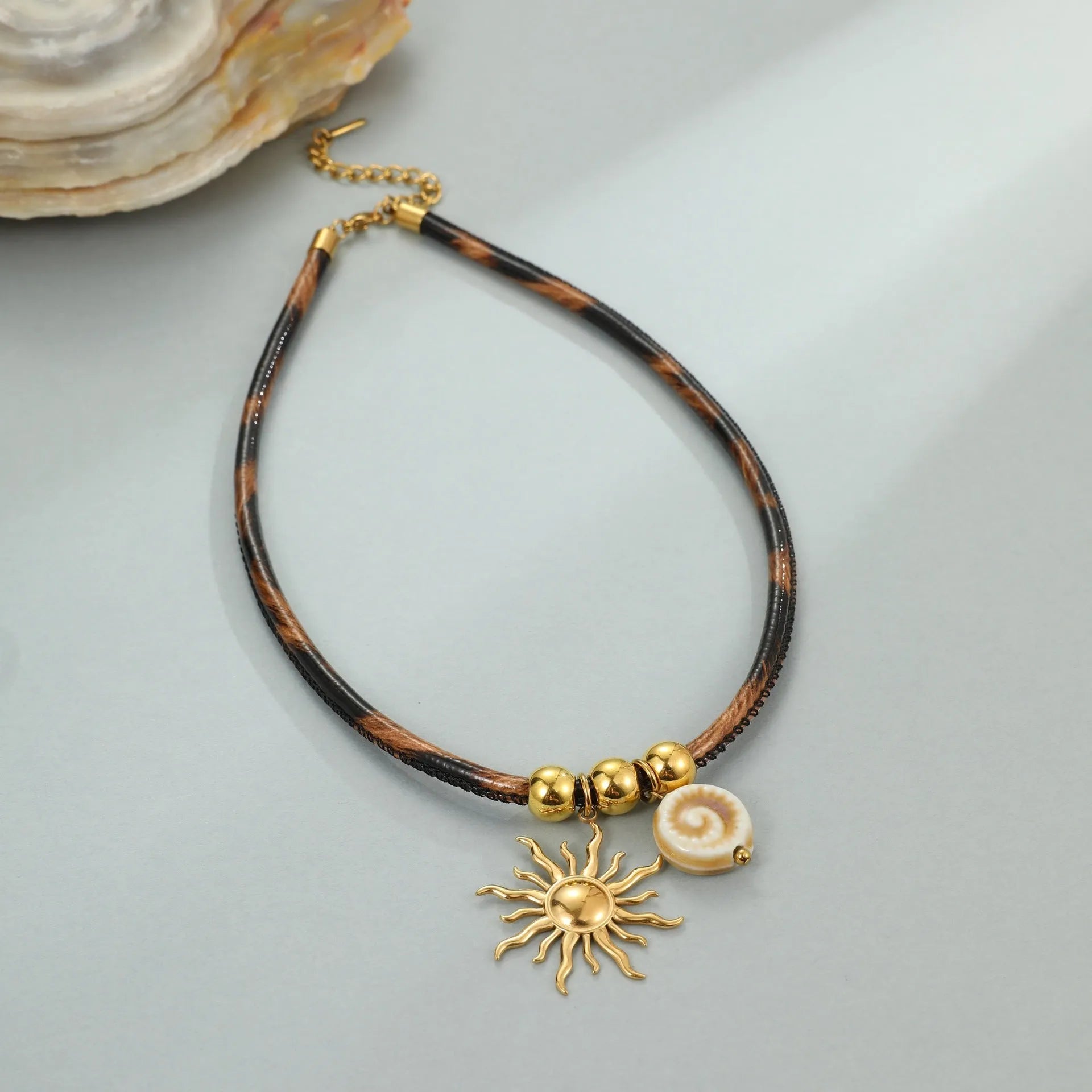 Geometric leopard pendant necklace for women on a stainless steel chain with adjustable length.