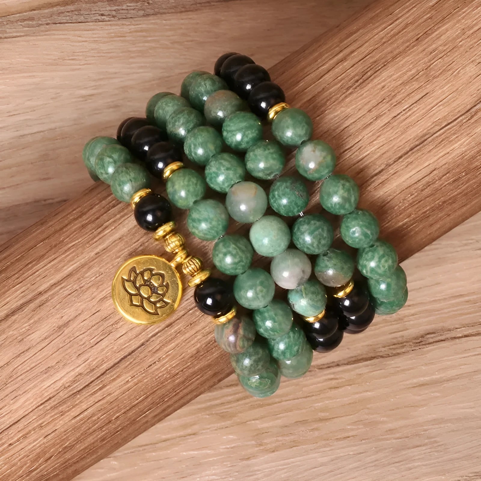 Green and black alloy elastic beaded bracelet with natural styling on wrist