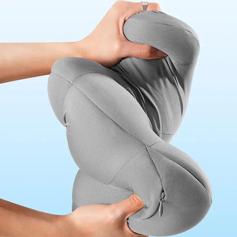 Grey and orange memory foam car head pillow and lumbar support pillow set on a car seat.