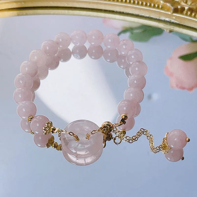 Pink crystal women's bracelet with distinctive peace buckle clasp, simple jewellery design