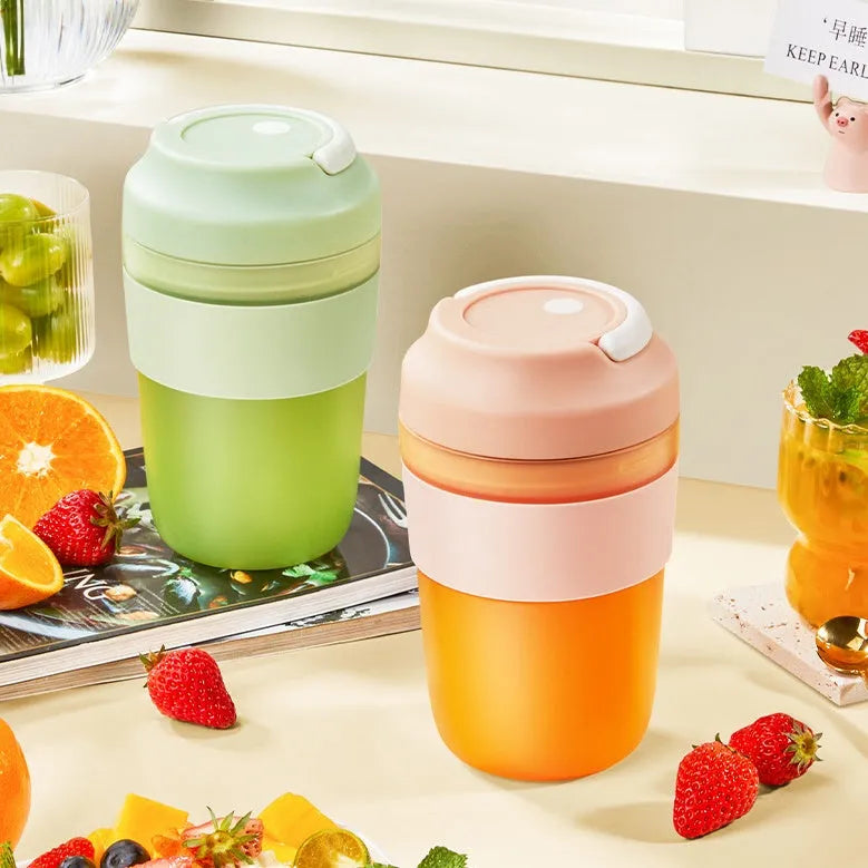 Portable purple rechargeable blender cup with four stainless steel blades, 400ml capacity, shown with USB cable.