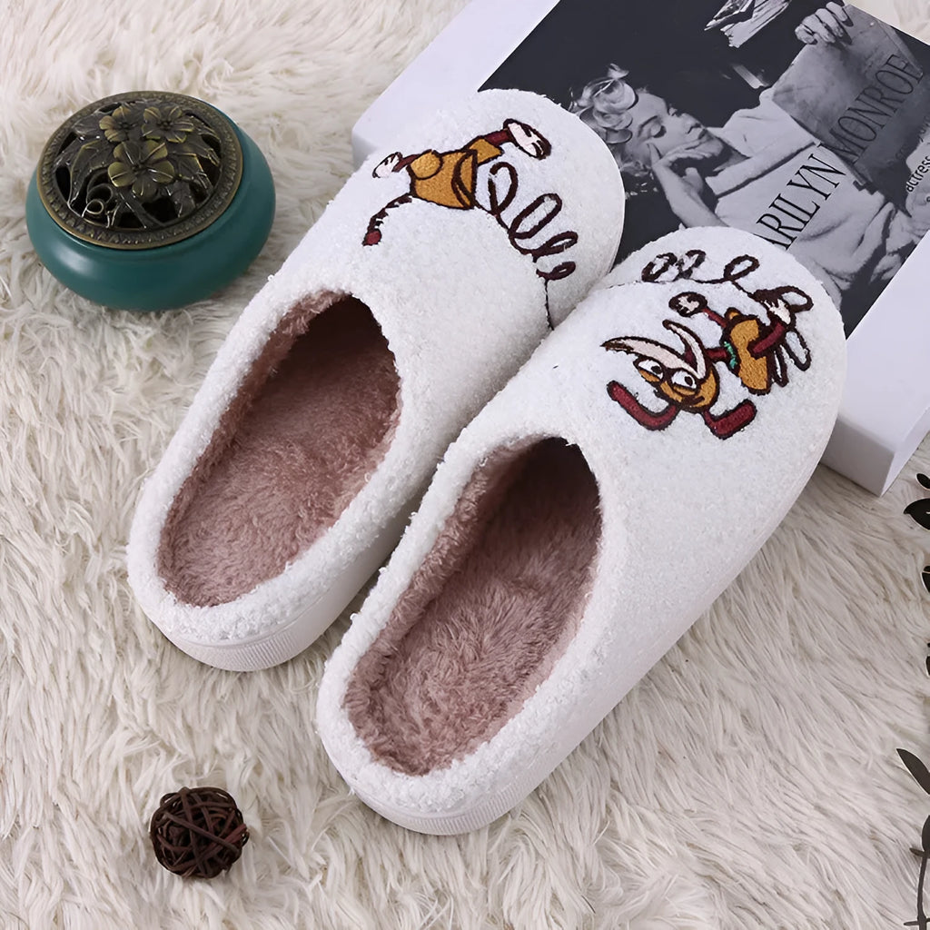 White fluffy slippers with cartoon pattern, rubber sole, and a toe holder design.