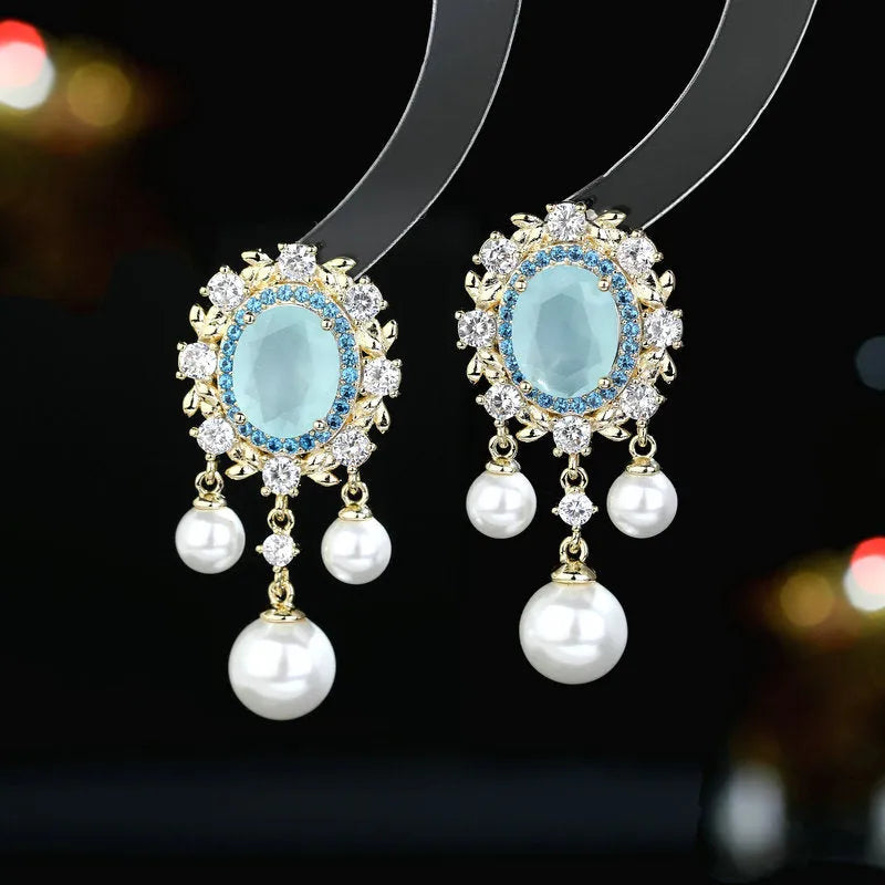 Oval geometric copper earrings with inlaid zircon accents and pearl tassel drops in light purple colour