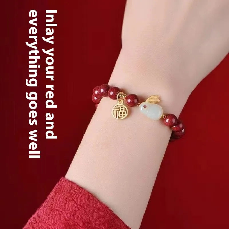 Cinnabar hare bracelet in purple gold sand colour with traditional bead design