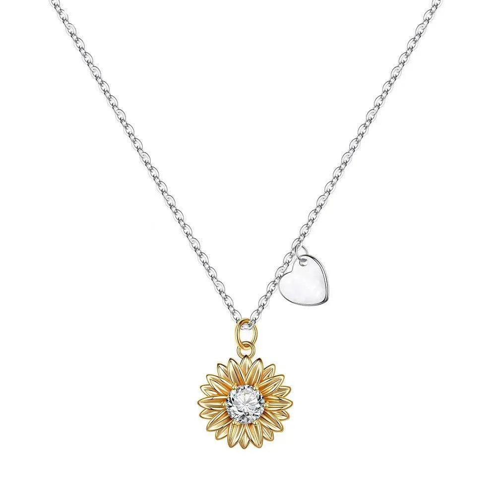Close-up of a sterling silver sunflower necklace with geometric daisy pendant on an adjustable cross chain.