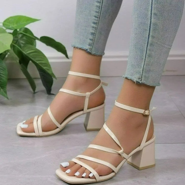 Plus size women's open toe slippers with an ankle buckle in beige, showing square toe shape.