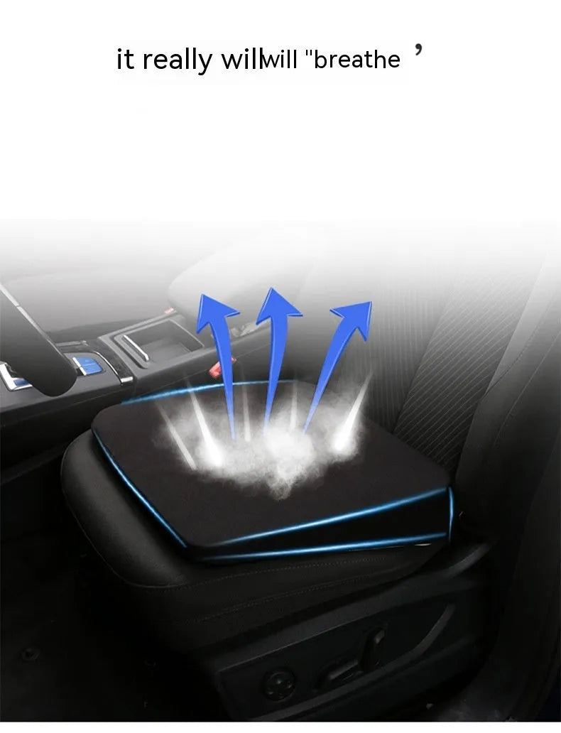 Black car seat cushion with dimensions 42x39x6cm on vehicle seat