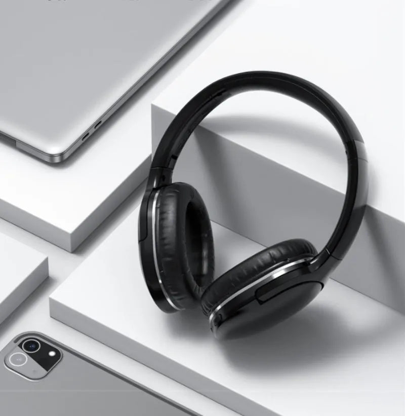 Black and white wireless Bluetooth sports gaming headset with over-ear design.