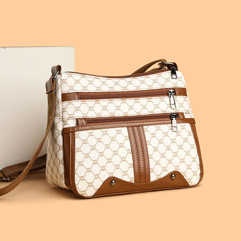 Brown women's crossbody bag with stitching pattern design and adjustable strap