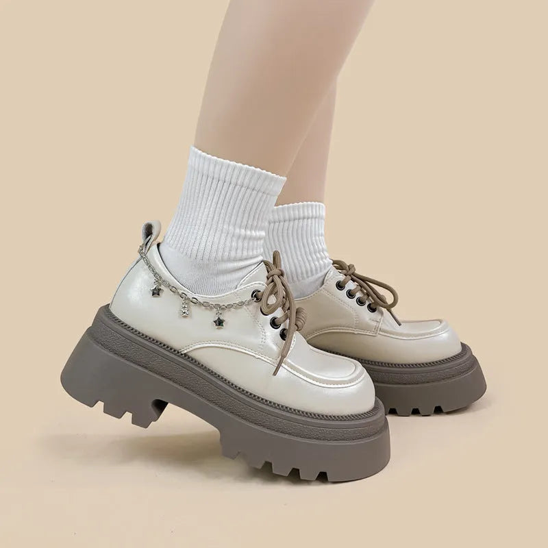 White platform leather shoes with chunky heel and round toe in British style