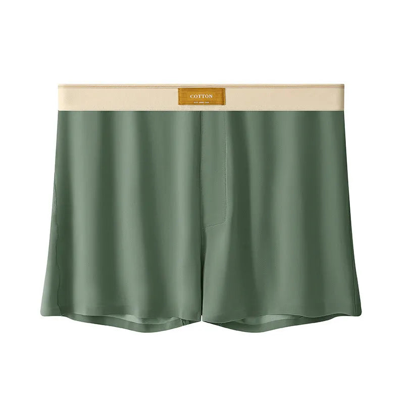 Pack of three men's solid colour ice silk boxer shorts laid flat.