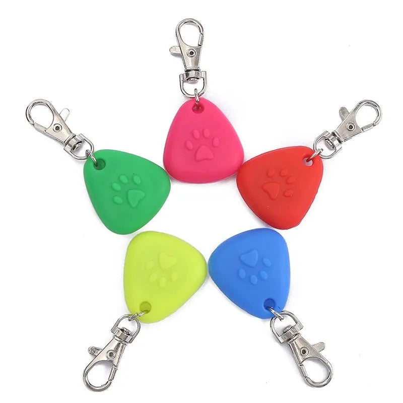 Silicone triangle-shaped light-up pendant for pet costumes in red, pink, blue, green, and yellow colours.