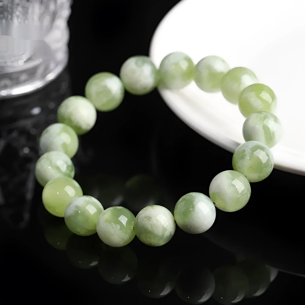 Green milk-in-water Xiuyan jade bracelet with geometric beads in single circle design
