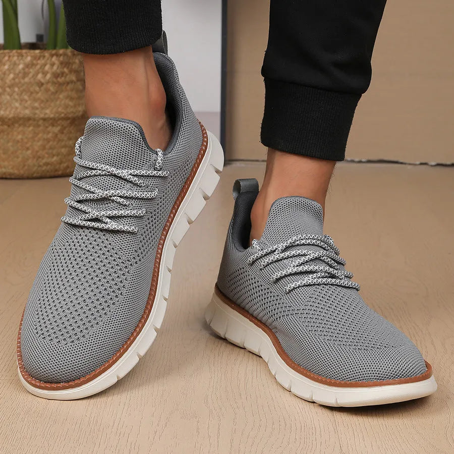 Men's grey and black casual sneakers with mesh fabric upper and round toe design
