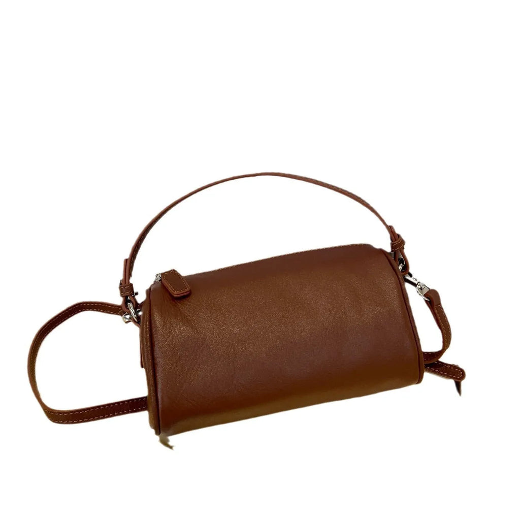 Cylindrical genuine leather crossbody bag in dark brown with contrast stitching