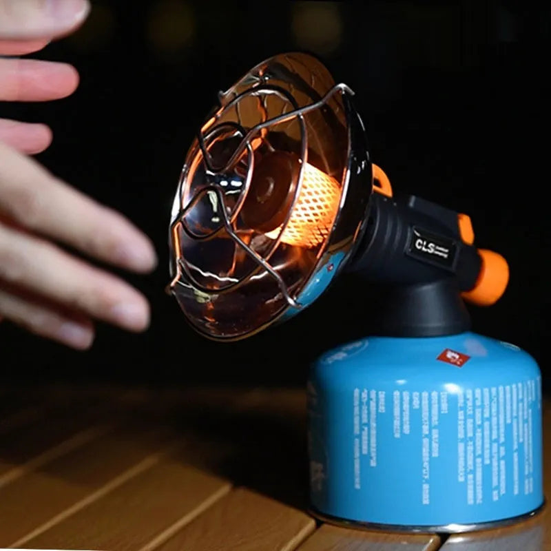 Portable outdoor heating stove with black and orange design showing automatic press ignition