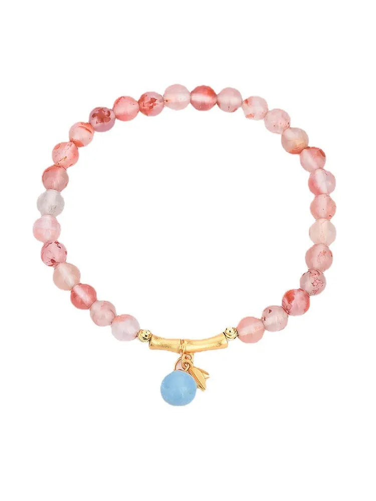 Agate ethnic bracelet with flower shape and bamboo joint design in Hetian Jade colour.