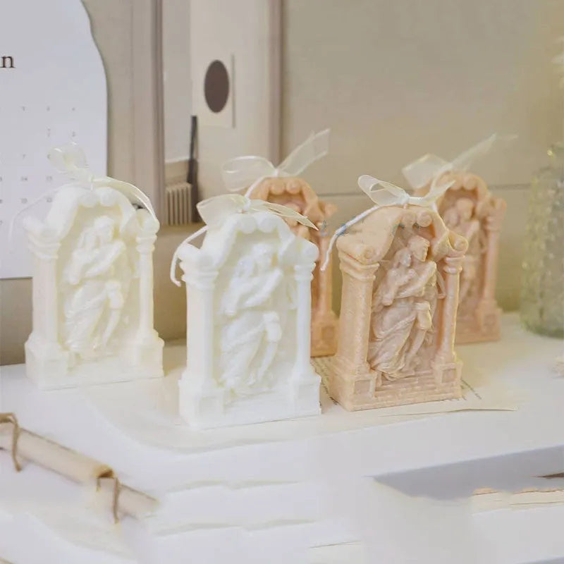 Food-grade silicone mould showing detailed Ancient Greek couple angel design for baking and crafts.