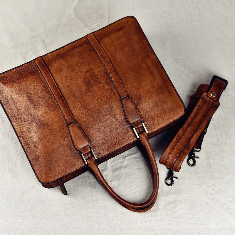 Men's brown leather retro handbag with a horizontal square shape and zipper opening
